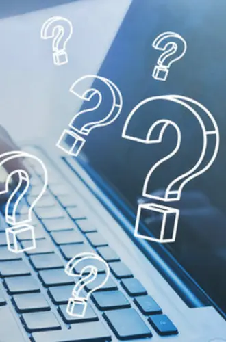 Close-up of laptop keyboard with white question mark icons floating above it, representing online inquiries and digital questions about mental health assessments and therapy services