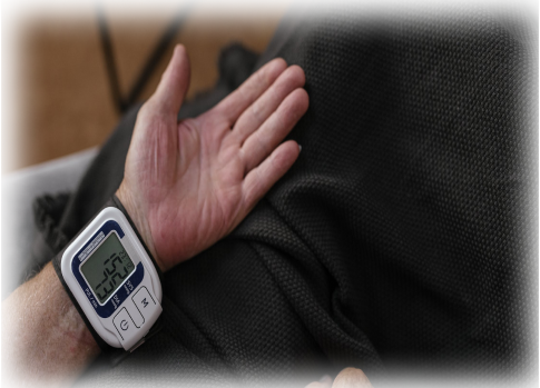 Person testing out and setting up their blood pressure cuff.